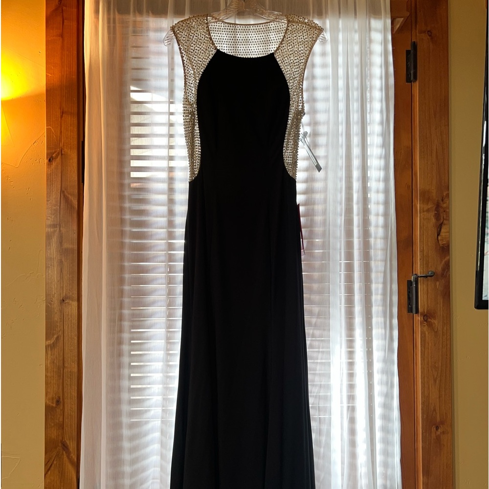 Glamorous Black dress with Sequins on top down to waist. Flattering Fit.